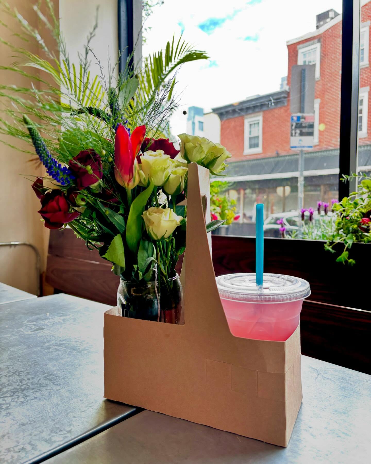 Drinks and flowers in window
